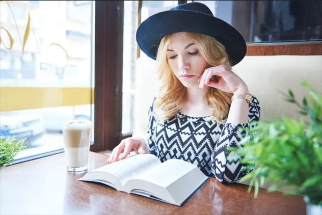 Woman reading notes outdoors